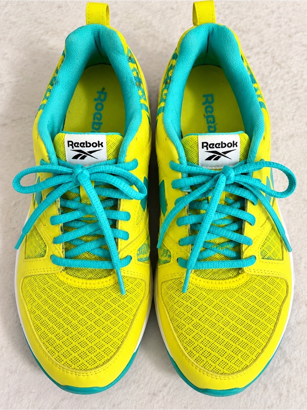 Reebok women’s Yellow and Teal Athletic Sneakers